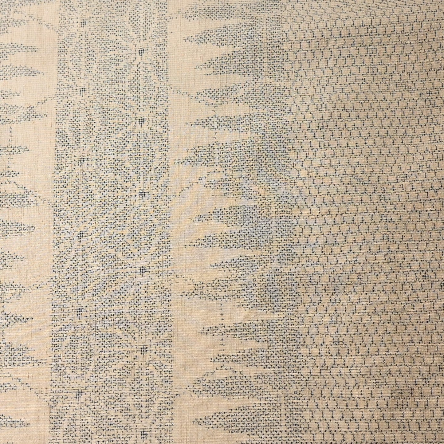 Cream beige tsumugi silk with geometric pattern in blue.